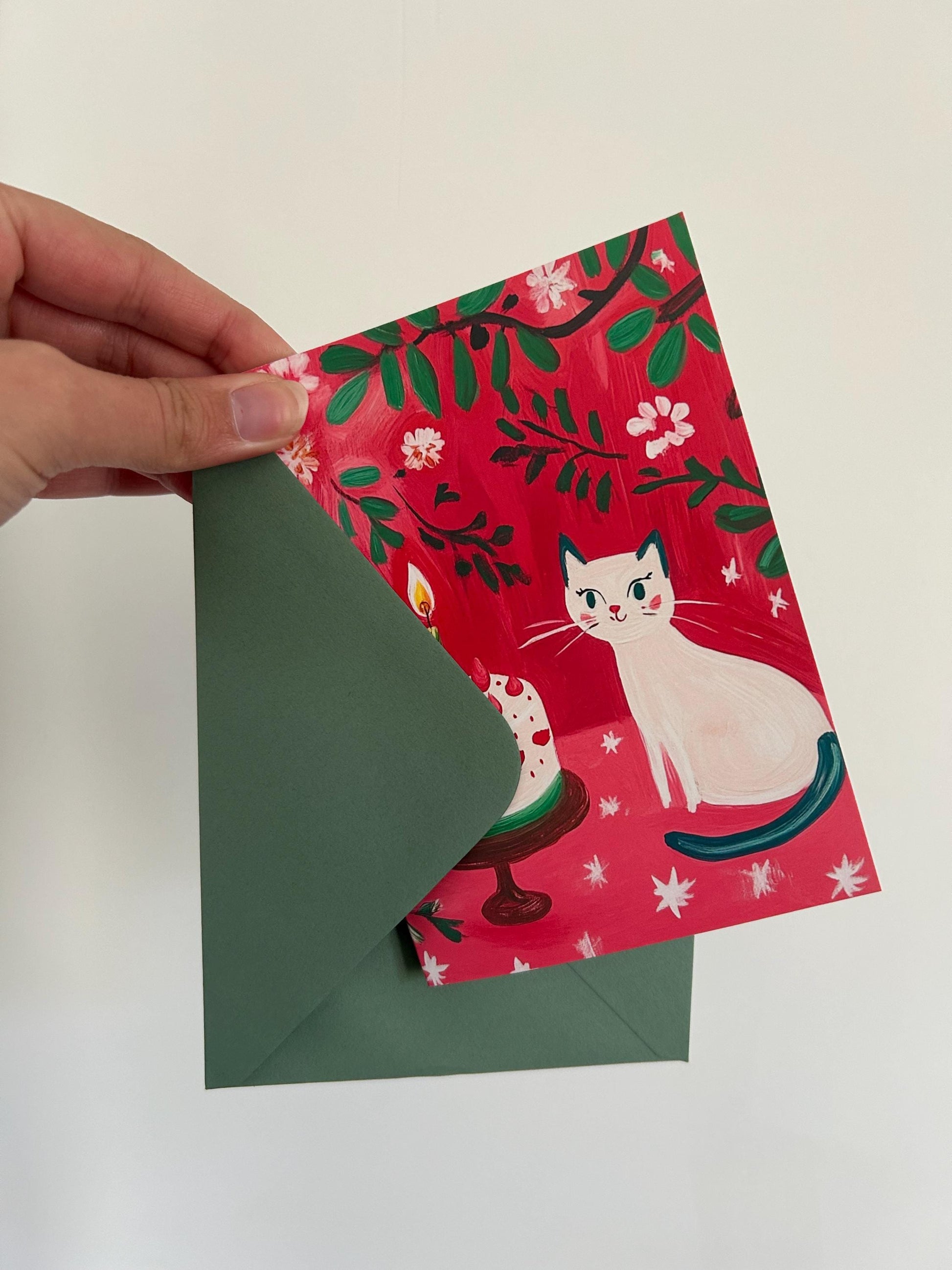 Carte anniversaire chat blanc  – illustration festive avec gâteau, cœurs et fleurs – papeterie joyeuse et poétique - A6